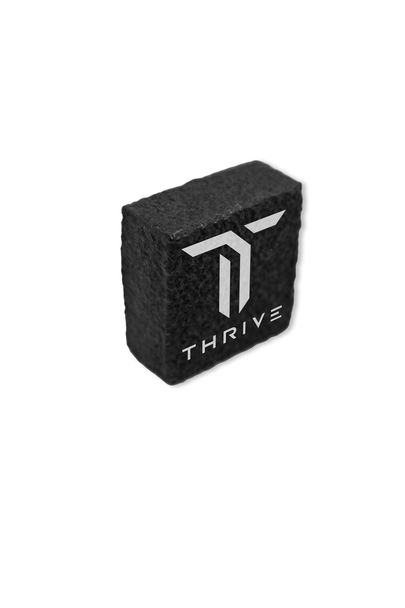 Black rectangular paddle eraser with subtle textured surface.