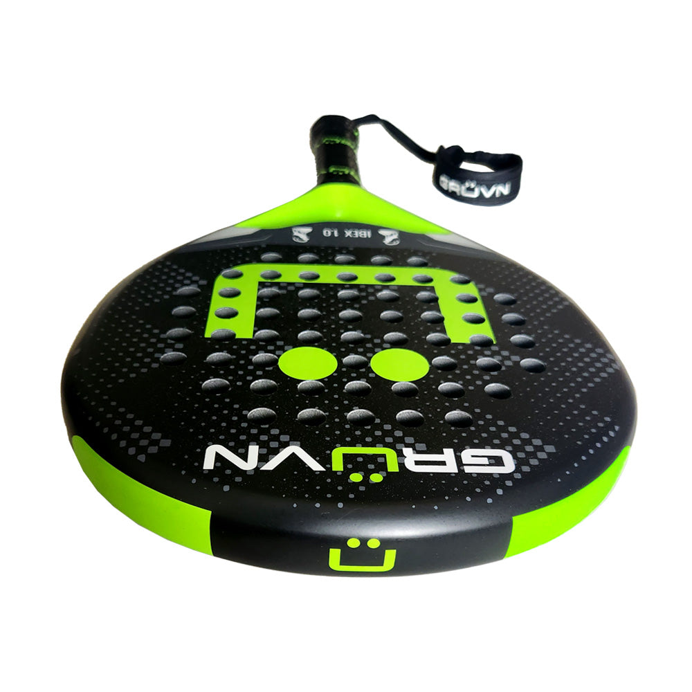 Black and lime green padel racket with textured surface and wrist strap.