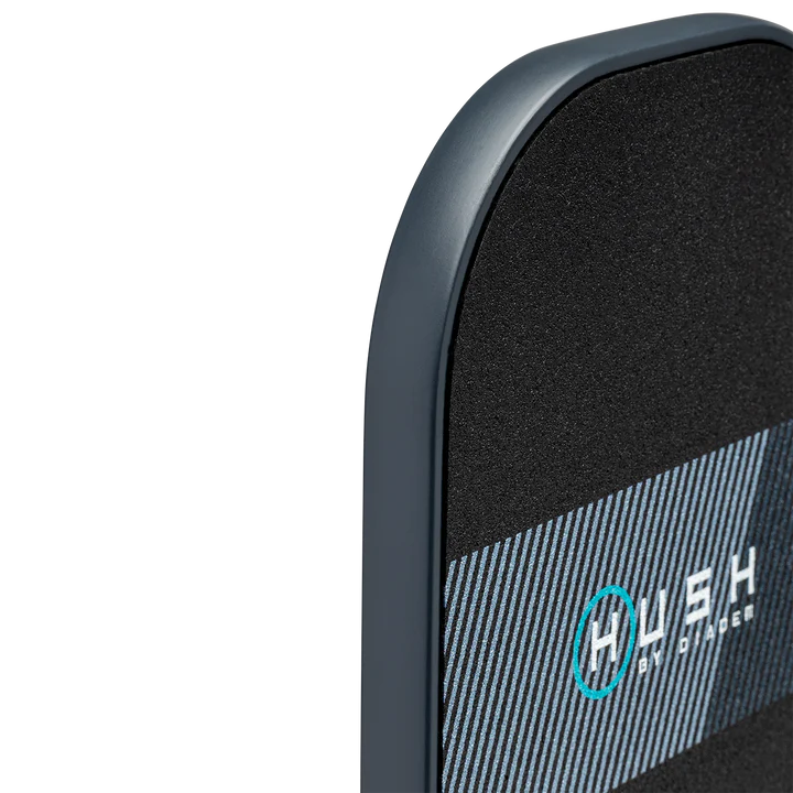 Close-up of a dark gray paddle with a textured surface and subtle striped design.