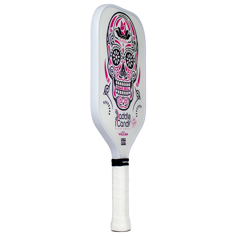 White pickleball paddle with a pink and black sugar skull design.