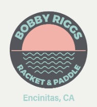 Circular logo featuring a pink sun setting over teal waves, text reading "Bobby Riggs Racquet & Paddle, Encinitas, CA".