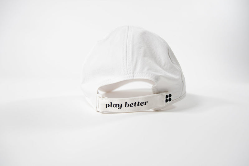 White cotton baseball cap, rear view, showcasing "play better" detail.