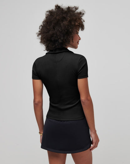 Black ribbed knit V-neck polo shirt, short sleeves, model shown from behind.
