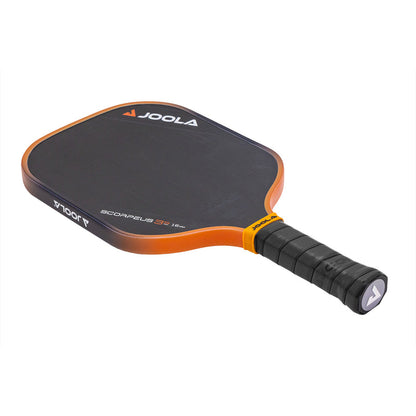 Black and orange pickleball paddle with textured grip.
