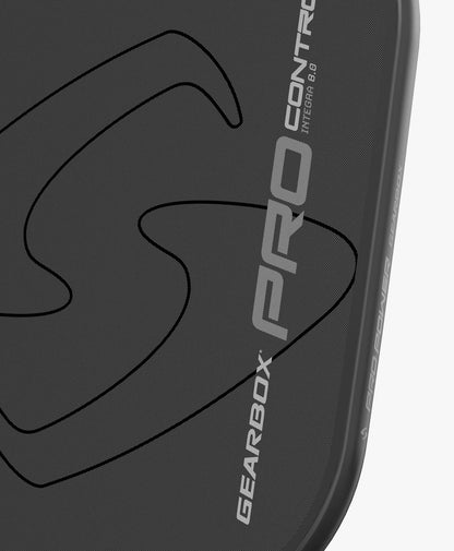 Close-up of dark gray paddle, textured surface, Integra 8.0 control.
