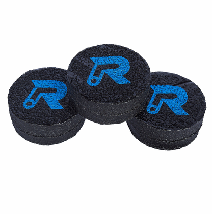 Three black pickleball paddle erasers with blue logo, close-up view.
