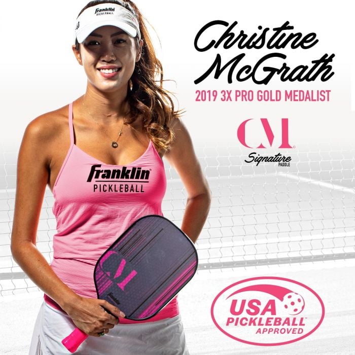 Pickleball pro Christine McGrath holding her signature paddle, a fiberglass model with MaxGrit surface.
