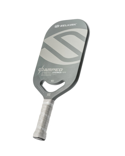 Gray pickleball paddle with white accents, showcasing a lightweight design and honeycomb core.
