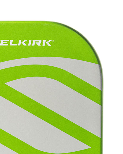 Close-up of lime green pickleball paddle with gray accents.
