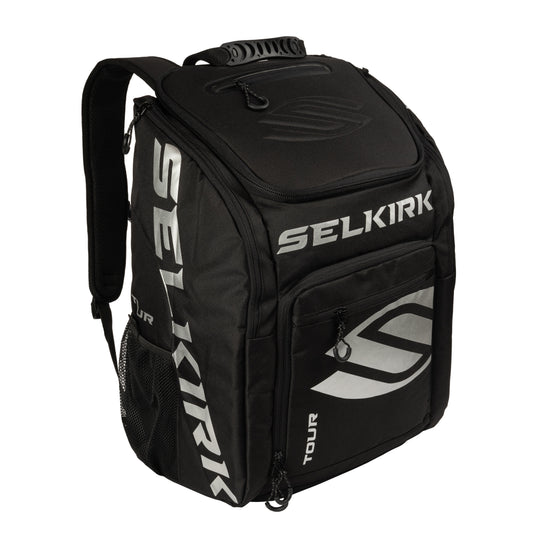 Selkirk Core Line Tour Backpack: Black backpack with silver logo, multiple compartments, and padded straps for players.
