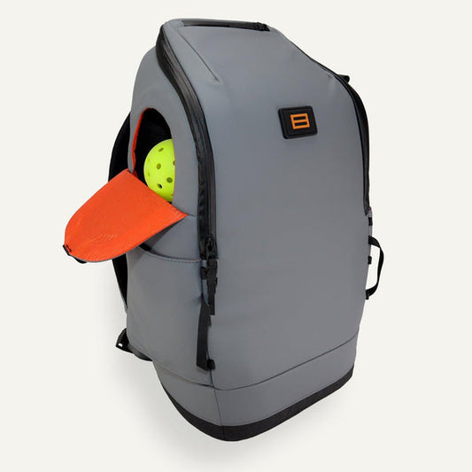 FORWRD Court Caddy Pickleball Backpack: Gray, durable backpack with dedicated ball & hat pockets for pickleball players.
