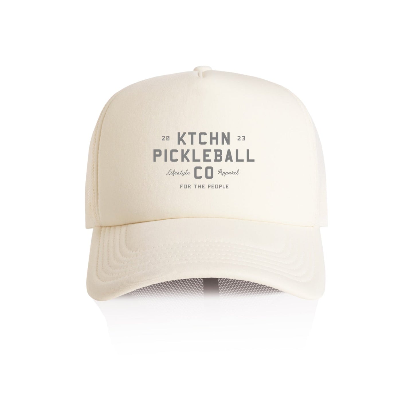 Cream-colored foam trucker hat with a gray logo; lifestyle apparel.
