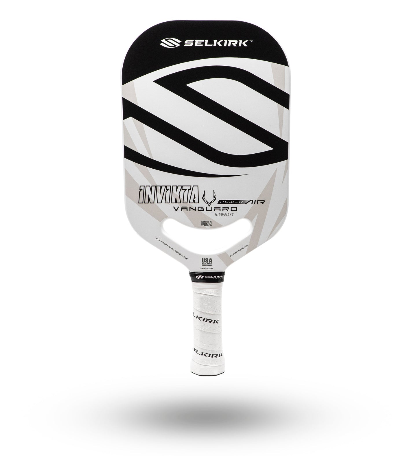 White and black pickleball paddle with a textured grip, shown against a white background.
