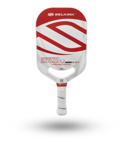 Red and white pickleball paddle with a honeycomb core, shown against a white background.
