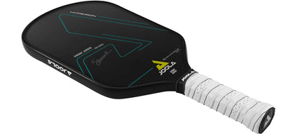 Black pickleball paddle with teal accents, white grip, and a player's signature.
