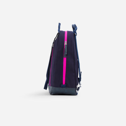 Navy blue canvas backpack with hot pink zipper detail.
