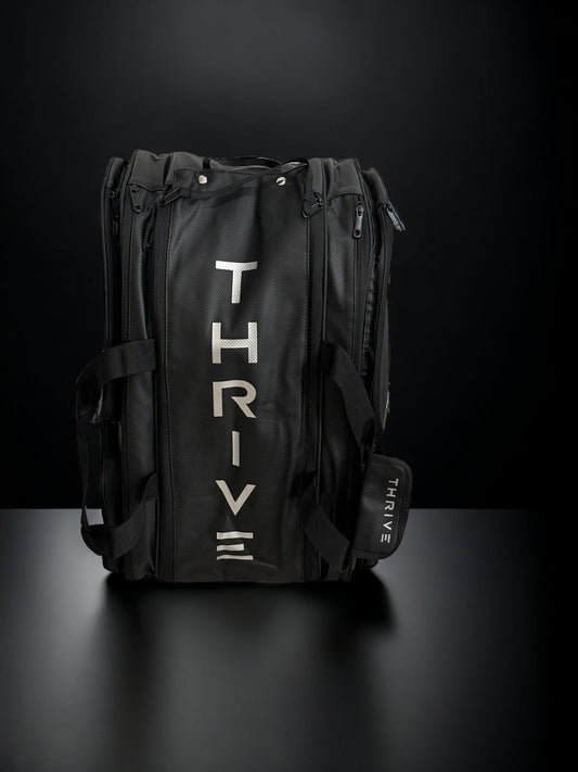 Thrive Elite Pro Tour Bag with shoe bag: Black, durable travel bag featuring the Thrive logo.
