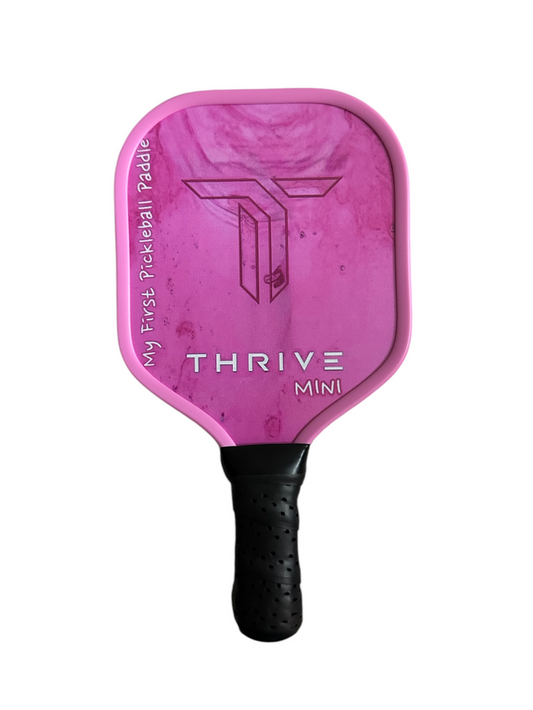 Thrive Mini Pickleball Paddle: Pink paddle with textured grip, ideal for kids or beginners.
