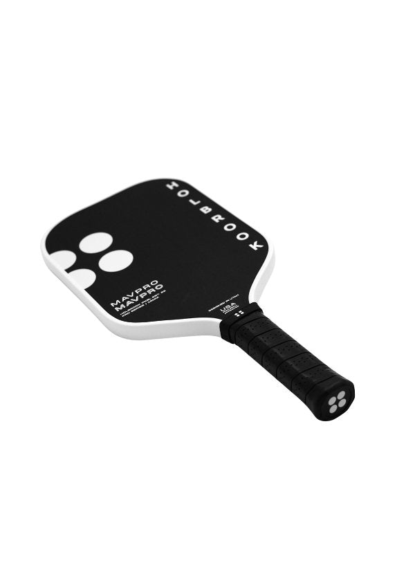 Black and white pickleball paddle with textured grip, angled view.
