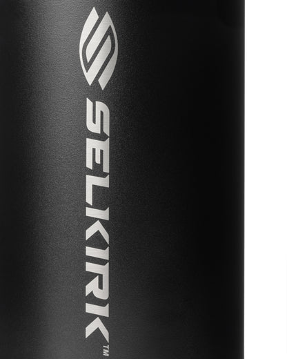 Close-up of a black water bottle's textured surface with a silver logo.
