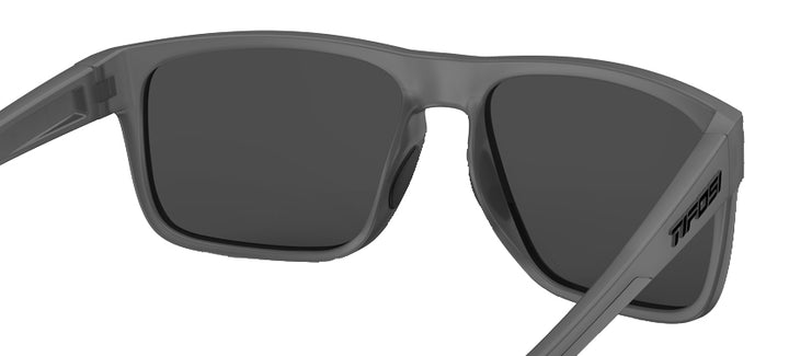 Close-up of gray smoke sunglasses with dark lenses.
