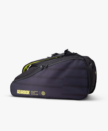 Black sports bag with yellow accents, shown on a white background.
